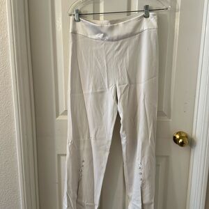 Johnathan Simkhai white pant with open flare on bottom with buttons